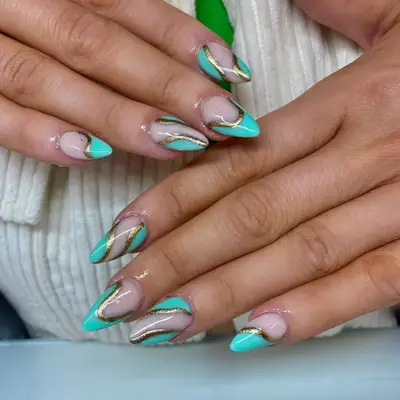 Tiffany blue and gold swirl nails