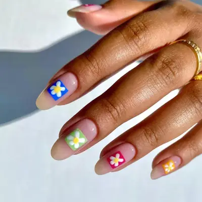 Nude nails with colored squares and flower details