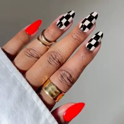 Black and white checkerboard long nails with cherry red accent nails