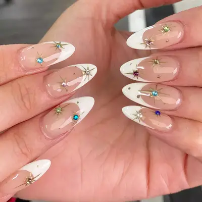 Gel-x natural-look mani with colorful gems and French tips