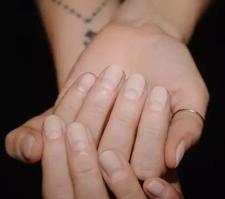 Matte nude manicure with bare half moon arches