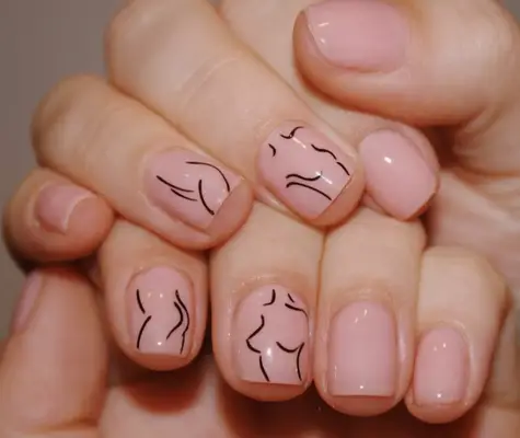 Pale pink nails with nude female form line drawins