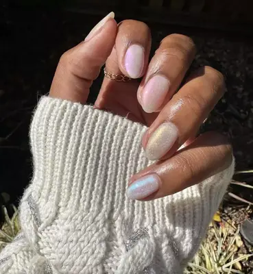 Almond-shaped nails with gradient of opalescent polish on each nail