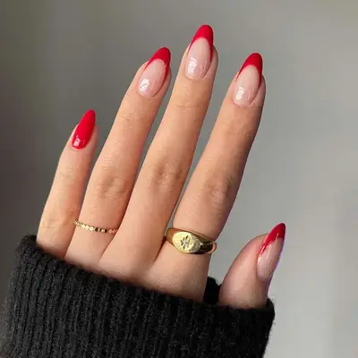 Red manicure with four French tips and one solid red nail - MYM Beauty Lunar New Year Nail Ideas