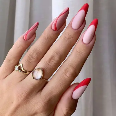 Matte red swirl nails with three French tips - MYM Beauty Lunar New Year Nail Ideas