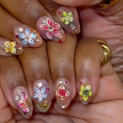 Floral nail art with rhinestones