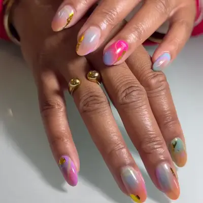 Multi-colored water color nails with gold detailing