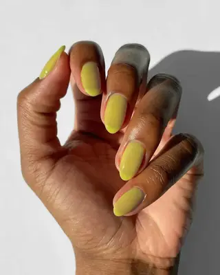 model wearing neon green nails