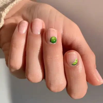 Short nude nails with lifelike lime nail art