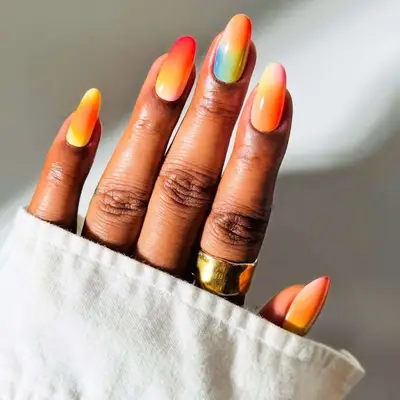 Long oval nails with rainbow ombre design