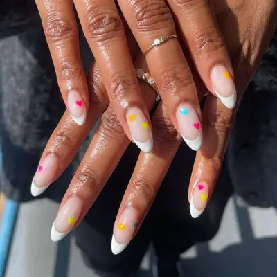 French manicure with colorful hearts