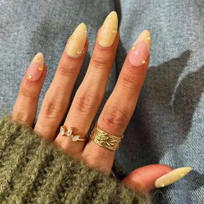 Manicure with butter yellow glitter polish and rhinestones