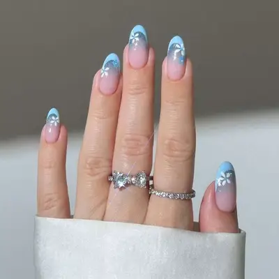 Baby blue French tips with airbrush flowers