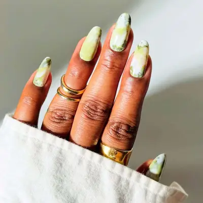 Long nails with green marble design