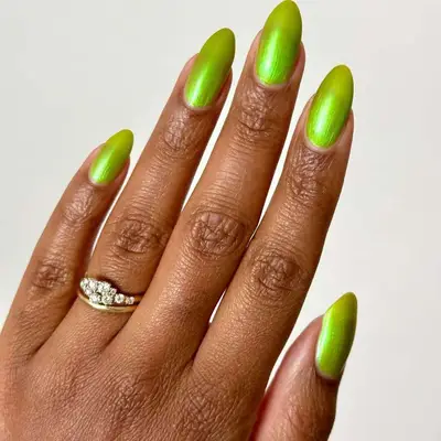 Long nails with lime green metallic nail polish.