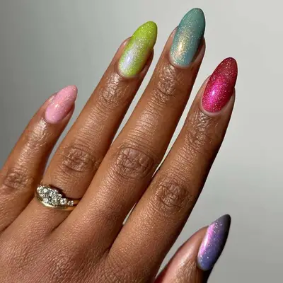 Manicure with different colorful glitter polishes 
