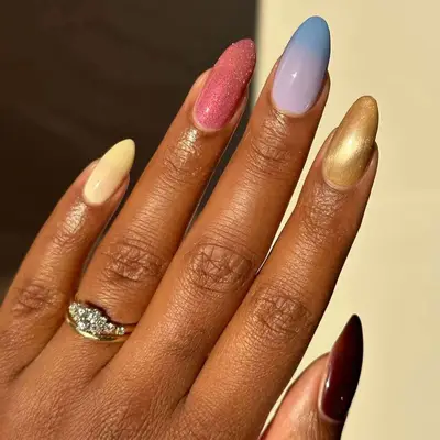 Long nails with mixed colors and finishes.