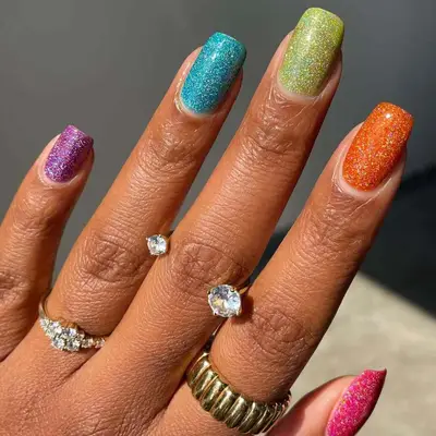 Square nails with different color glitter nail polishes 