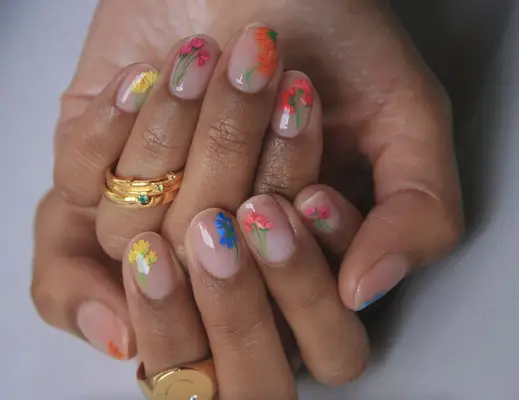 Short nude nails with bright hand-painted floral nail art