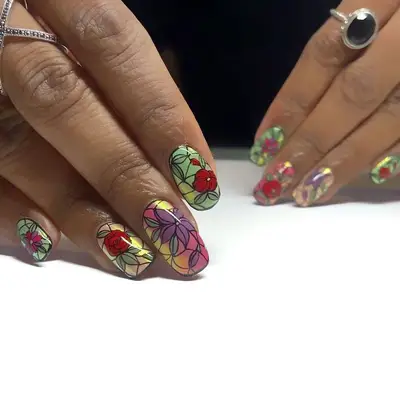 Rounded nails with multi-colored stained-glass floral nail art