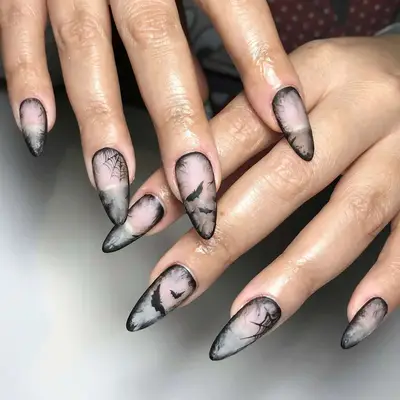 a smoky manicure with bat and spider web accents