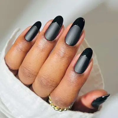 a two-tone black-on-black french manicure