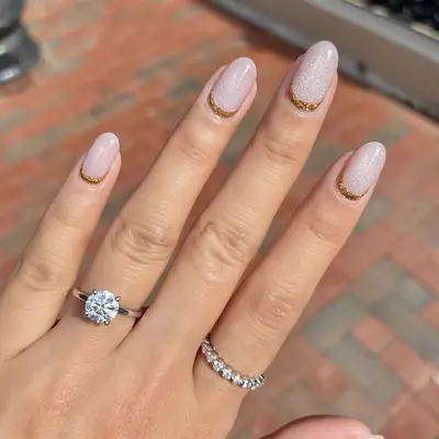 Bronze and shimmery, icy pale pink nails