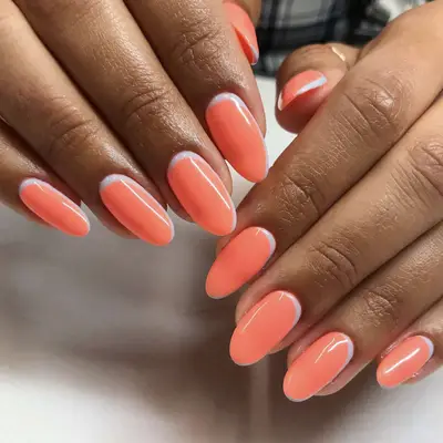 orange nails with white stripe at base