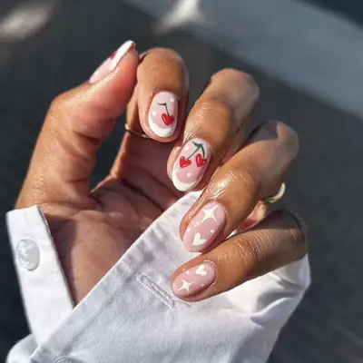 Short French Nails With Cherry Designs and White Stars and Hearts