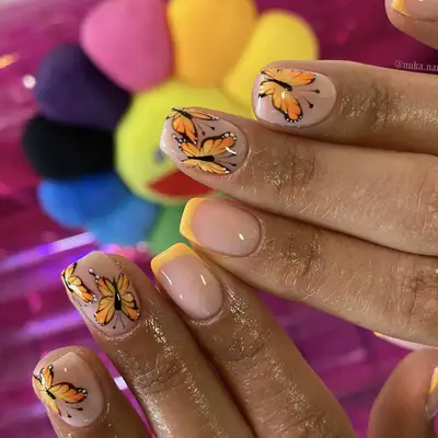 Short Nails with Monarch Butterfly Designs and Orange French Tips