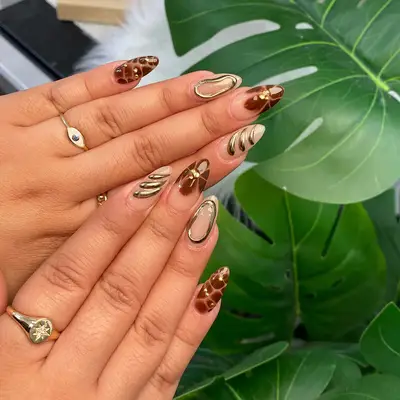 Brown and gold textured manicure