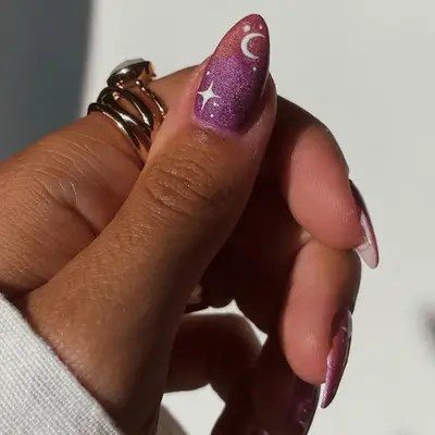 Deep green manicure with gold chrome star design