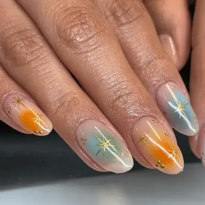 Lavender cloudy manicure with gems and white star ray details