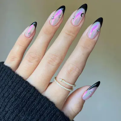 Black French manicure with iridescent chrome base and moon and star nail designs