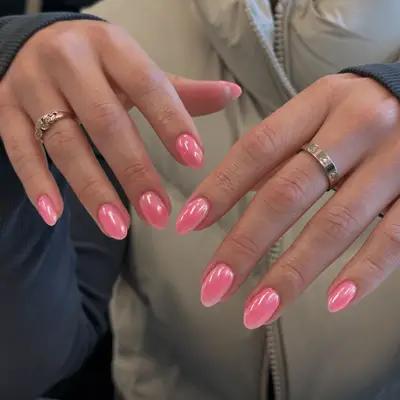 Manicure with pink chrome base and silver 3D abstract design.