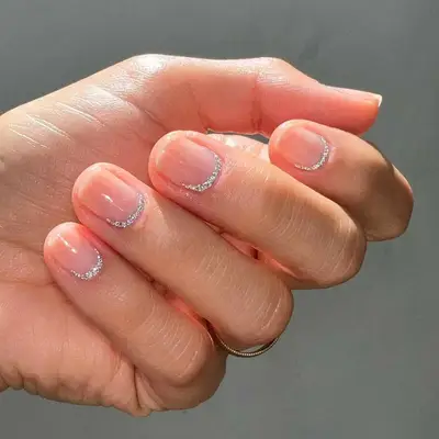 Neutral nails with shimmering cuticle accents
