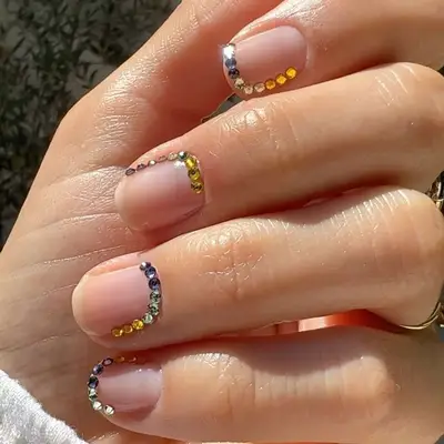 Gemstone edged cuticles on neutral manicure