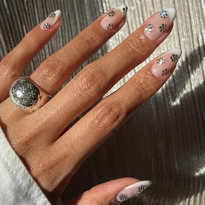 French tip manicure with floral rhinestone nail art