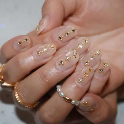 Neutral nails with gold and silver accents