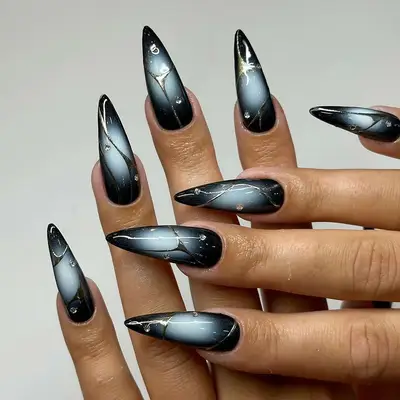 Black, gray, and white manicure with fine line nail art and diamonds