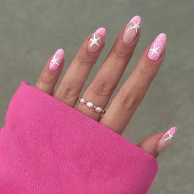 Close up of pint water printed nails with white starfish.