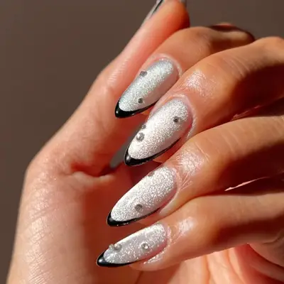 a velvet glass french manicure with diamond rhinestone accents