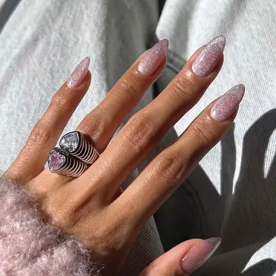 a sheer pink sparkly manicure