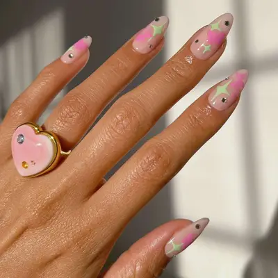 Pastel pink and green nails with rhinestones