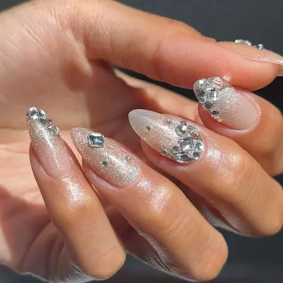 a sheer velvet mani topped with chunky gems