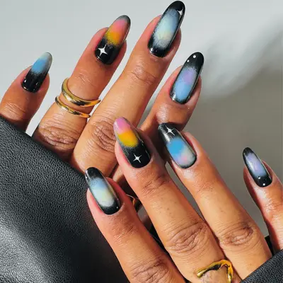 black aura nails with sparkle designs