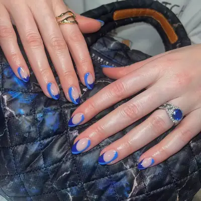 White nails with a blue porcelain design