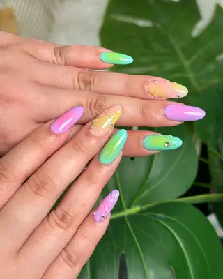 a light tropical mismatched manicure