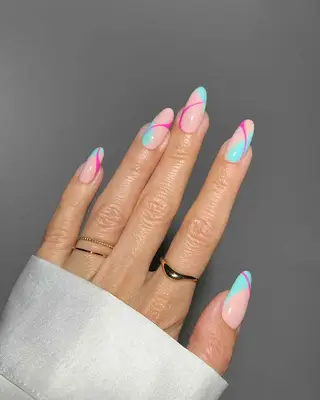 a swirly manicure with turquoise accents