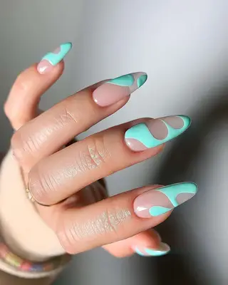 a turquoise negative space manicure 